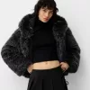 Fusta mini cu pliuri cutie cu detaliu fundita Fusta mini cu pliuri cutie cu detaliu fundita