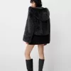 Fusta mini cu pliuri cutie cu detaliu fundita Fusta mini cu pliuri cutie cu detaliu fundita