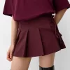 Fusta mini cu pliuri cutie cu detaliu fundita Fusta mini cu pliuri cutie cu detaliu fundita