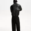 Pantaloni croiți super largi