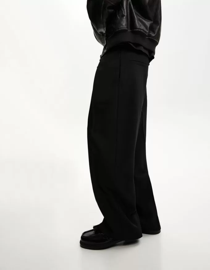 Pantaloni croiți super largi