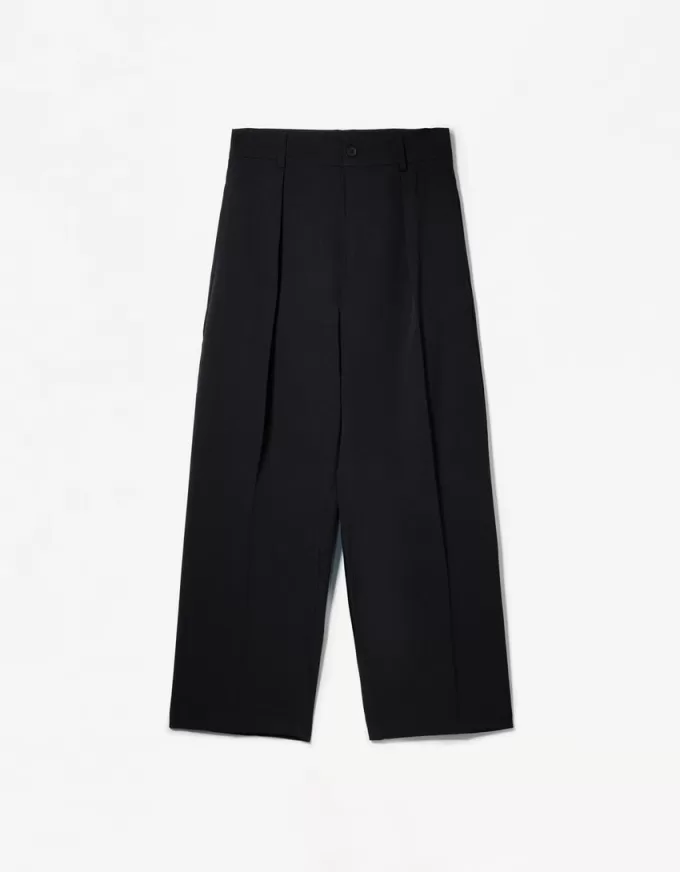 Pantaloni croiți super largi