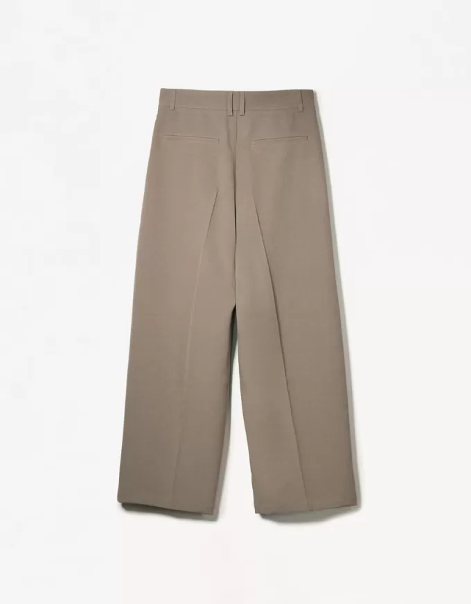 Pantaloni croiți super largi