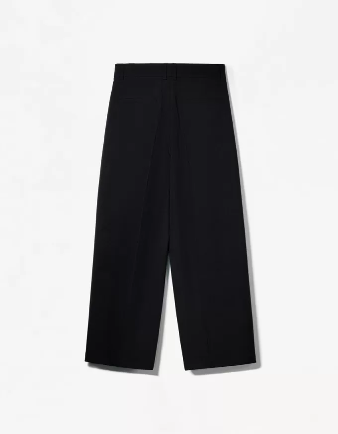 Pantaloni croiți super largi