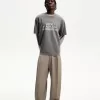 Pantaloni croiți super largi