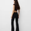 Pantaloni evazați cu șuruburi