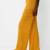 Pantaloni evazați din tricot deschis rustic Pantaloni evazați din tricot deschis rustic