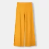 Pantaloni evazați din tricot deschis rustic Pantaloni evazați din tricot deschis rustic