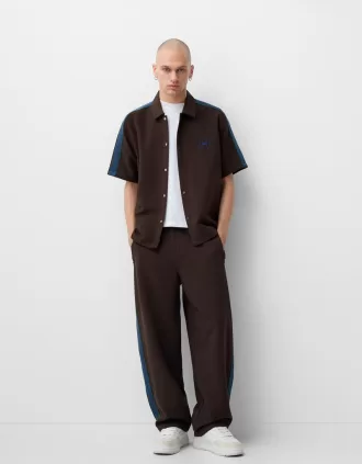 Pantaloni largi cu dungi laterale