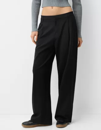 Pantaloni largi cu talie joasă