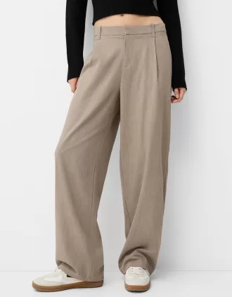 Pantaloni largi cu talie joasă