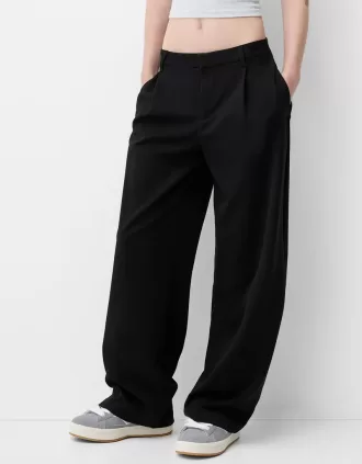Pantaloni largi cu talie joasă