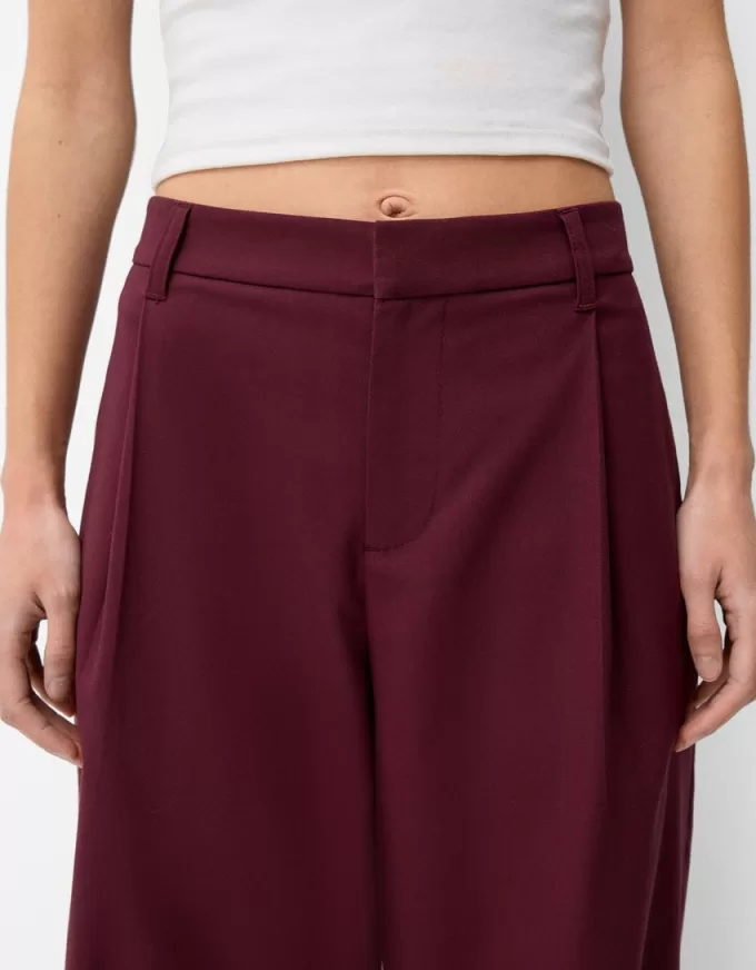 Pantaloni largi cu talie joasă Pantaloni largi cu talie joasă