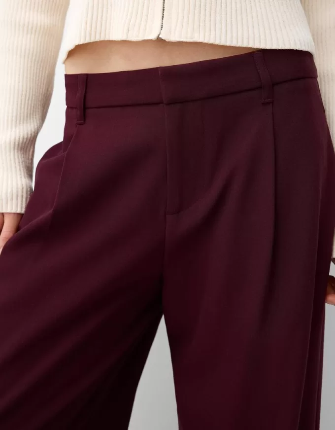 Pantaloni largi cu talie joasă Pantaloni largi cu talie joasă