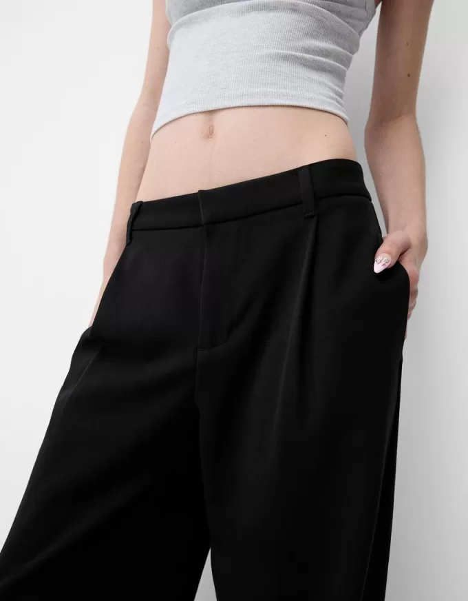 Pantaloni largi cu talie joasă Pantaloni largi cu talie joasă