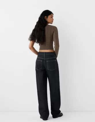 Pulover asimetric din tricot cablu