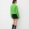 Pulover oversize decupat cu coaste cu gât înalt